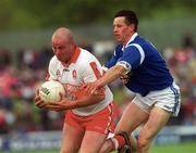 14 May 2000; Geoffrey McGonagle of Derry in action against Philip Smith of Cavan during the Bank of Ireland Ulster Senior Football Championship Quarter-Final match between Cavan and Derry at Breffni Park in Cavan. Photo by Ray Lohan/Sportsfile