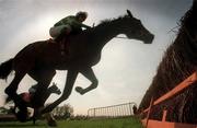 5 May 2000; Grimes, with Charlie Swan, up jumps the last on their way to winning the Shell Champion Hurdle at Punchestown Racecourse in Kildare. Photo by Matt Browne/Sportsfile