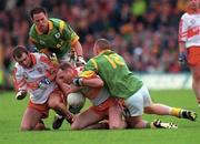 20 May 2000; Henry Downey of Derry in action against Tommy Dowd, right, and Ronan Fitzsimons of Meath during the Church & General National Football League Final Replay match between Derry and Meath at St Tiernach's Park in Clones, Monaghan. Photo by Aoife Rice/Sportsfile