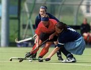 6 May 2000; Rachel Kohler of Cork Harlequins is tackled by SinŽad McDonnell, right, and Carol Devine of Hermes during the Irish Senior Ladies Cup Final match between Cork Harlequins and Hermes at UCD Belfield in Dublin. Photo by Damien Eagers/Sportsfile