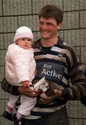 29 April 2000; Blackrock's Hubie Kos, with his daughter Robyn, age 18 months, following the AIB All-Ireland League Division 2 match between Blackrock College and Old Crescent at Stradbrook Road in Dublin. Photo by Ray McManus/Sportsfile