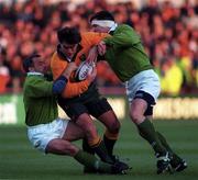 23 November 1996; Michael Brial of Australia is tackled by Denis McBride, left, and Anthony Foley of Ireland during the Autumn International match between Ireland and Australia at Lansdowne Road in Dublin. Photo by David Maher/Sportsfile