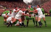 15 February 1997; Niall Hogan of Ireland tumbles at the feet of England's Graham Rowntree, left, and Lawrence Dallaglio right, during the Five Nations Rugby Championship match between Ireland and England at Lansdowne Road in Dublin. Photo by David Maher/Sportsfile