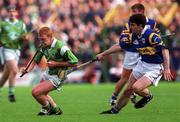 30 April 2000; James Butler of Limerick in action against Liam Sheedy of Tipperary during the Church & General National Hurling League Division 1 Semi-Final match between Tipperary and Limerick at Semple Stadium in Thurles, Tipperary. Photo by Ray McManus/Sportsfile