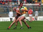 7 May 2000; James Grennan of Offaly in action against Nicky Malone of Louth during the Church & General National Football League Division 2 Final match between Louth and Offaly at Croke Park in Dublin. Photo by Brendan Moran/Sportsfile