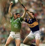30 April 2000; James Moran of Limerick in action against Liam Cahill of Tipperary during the Church & General National Hurling League Division 1 Semi-Final match between Tipperary and Limerick at Semple Stadium in Thurles, Tipperary. Photo by Damien Eagers/Sportsfile
