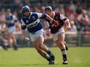 7 May 2000; James Young of Laois in action against Martin Williams of Westmeath during the Guinness Leinster Senior Hurling Championship Round Robin match between Westmeath and Laois at Cusack Park in Mullingar, Westmeath. Photo by Damien Eagers/Sportsfile
