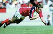 6 May 2000; Jason Holand of Munster dives over to the score his side's third try during the Heineken Cup Semi-Final match between Toulouse and Munster at the Stade du Parc Lescure in Bordeaux, France. Photo by Matt Browne/Sportsfile