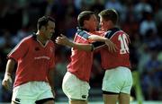 6 May 2000; Jason Holland of Munster, centre, is congratulated by team-mate Ronan O'Gara, right, after scoring his side's third try during the Heineken Cup Semi-Final match between Toulouse and Munster at the Stade du Parc Lescure in Bordeaux, France. Photo by Brendan Moran/Sportsfile