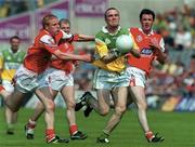 7 May 2000; Joe Kilmurray of Offaly in action against JP Rooney of Louth during the Church & General National Football League Division 2 Final match between Louth and Offaly at Croke Park in Dublin. Photo by Brendan Moran/Sportsfile