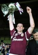 14 May 2000; Galway captain Joe Rabbitte lifts the cup following his side's victory during the Church & General National Hurling League Final match between Tipperary and Galway at the Gaelic Grounds in Limerick. Photo by Brendan Moran/Sportsfile