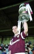 14 May 2000; Galway captain Joe Rabbitte lifts the cup following his side's victory during the Church & General National Hurling League Final match between Tipperary and Galway at the Gaelic Grounds in Limerick. Photo by Brendan Moran/Sportsfile