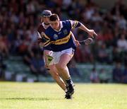 14 May 2000; John Carroll of Tipperary in action against Mark Kerins of Galway during the Church & General National Hurling League Final match between Tipperary and Galway at the Gaelic Grounds in Limerick. Photo by Brendan Moran/Sportsfile