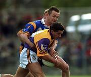 20 May 2000; John Hegarty of Wexford in action against Mark Coffey of Wicklow during the Bank of Ireland Leinster Senior Football Championship Group Stage Round 3 match between Wicklow and Wexford at Aughrim County Ground in Aughrim, Wicklow. Photo by Matt Browne/Sportsfile