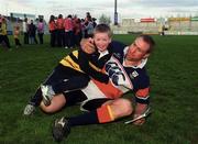 2 May 2000; John Langford, right, wrestles with supporter Lewis Dickinson, from Limerick, during a Munster Rugby training session at Thomond Park in Limerick. Photo by Brendan Moran/Sportsfile