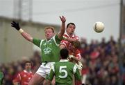 20 May 2000; John Quane of Limerick in action against Michael O'Sullivan and Aidan Dorgan of Cork during the Bank of Ireland Munster Senior Football Championship Quarter-Final match between Limerick and Cork at Fitzgerald Park in Kilmallock, Limerick. Photo by Damien Eagers/Sportsfile