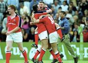 6 May 2000; Killian Keane of Munster, centre, celebrates team-mates Eddie Halvey, left, and Dominic Crotty at the final whistle following their side's victory during the Heineken Cup Semi-Final match between Toulouse and Munster at the Stade du Parc Lescure in Bordeaux, France. Photo by Brendan Moran/Sportsfile