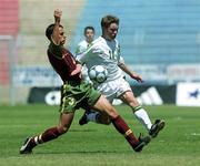 1 May 2000; Liam Kearney of Republic of Ireland in action against Pedro Ribeiro of Portugal during the UEFA U16 European Championship Finals match between Portugal and Republic of Ireland at Be'er Sheva Municipal Stadium in Be'er Sheva, Israel. Photo by David Maher/Sportsfile