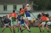 20 May 2000; Liam Keenan of Longford in action against Peter Kiernan of Carlow during the Bank of Ireland Leinster Senior Football Championship Group Stage Round 3 match between Carlow and Longford at Dr. Cullen Park, Carlow. Photo by Ray McManus/Sportsfile