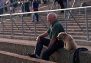 6 May 2000; A supporter and his dog on the terrace during the Guinness Leinster Senior Hurling Championship Round Robin match between Carlow and Dublin at Dr Cullen Park in Carlow. Photo by Damien Eagers/Sportsfile