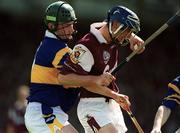 14 May 2000; Mark Kerins of Galway in action against David Kennedy of Tipperary during the Church & General National Hurling League Final match between Tipperary and Galway at the Gaelic Grounds in Limerick. Photo by Brendan Moran/Sportsfile