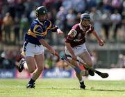 14 May 2000; Mark Kerins of Galway in action against Paul Ormonde of Tipperary during the Church & General National Hurling League Final match between Tipperary and Galway at the Gaelic Grounds in Limerick. Photo by Brendan Moran/Sportsfile