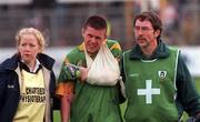 20 May 2000; Mark O'Reilly of Meath is helped from the field by medical staff following an injury to his arm during the Church & General National Football League Final Replay match between Derry and Meath at St Tiernach's Park in Clones, Monaghan. Photo by David Maher/Sportsfile