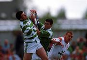 13 May 2000; Limerick goalkeeper Michael Keogh, left, and team-mate under Brian Geary contest for the ball, under pressure from Owen Mulligan of Tyrone during the All-Ireland U21 Football Championship Final match between Tyrone and Limerick at Cusack Park in Mullingar, Westmeath. Photo by Damien Eagers/Sportsfile