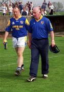 7 May 2000; Longford manager Michael McCormack, right, leaves the field following his side's defeat during the Bank of Ireland Leinster Senior Football Championship Group Stage Round 1 match between Wexford and Longford at O'Kennedy Park in New Ross, Wexford. Photo by Aoife Rice/Sportsfile