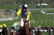 15 March 2000; Jockey Norman Williamson celebrates after winning the Royal & Sun Alliance Novice Hurdle on Monsignor during Day Two of the Cheltenham Racing Festival at Prestbury Park in Cheltenham, England. Photo by Ray Lohan/Sportsfile