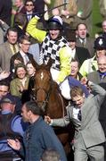 15 March 2000; Jockey Norman Williamson celebrates as he enters the winners' enclosure after winning the Royal & Sun Alliance Novice Hurdle on Monsignor during Day Two of the Cheltenham Racing Festival at Prestbury Park in Cheltenham, England. Photo by Matt Browne/Sportsfile