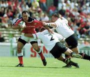 6 May 2000; Mike Mullins of Munster is tackled by Yannick Bru, centre, and Chriatian Califano of Toulouse during the Heineken Cup Semi-Final match between Toulouse and Munster at the Stade du Parc Lescure in Bordeaux, France. Photo by Matt Browne/Sportsfile