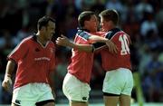 6 May 2000; Jason Holland of Munster, centre, is congratulated by team-mate Ronan O'Gara, right, after scoring his side's third try during the Heineken Cup Semi-Final match between Toulouse and Munster at the Stade du Parc Lescure in Bordeaux, France. Photo by Brendan Moran/Sportsfile