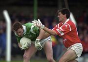 20 May 2000; Neilus Hunt of Limerick in action against Don Davis of Cork during the Bank of Ireland Munster Senior Football Championship Quarter-Final match between Limerick and Cork at Fitzgerald Park in Kilmallock, Limerick. Photo by Damien Eagers/Sportsfile