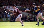 14 May 2000; Ollie Fahy of Galway in action against Philip Maher of Tipperary during the Church & General National Hurling League Final match between Tipperary and Galway at the Gaelic Grounds in Limerick. Photo by Brendan Moran/Sportsfile