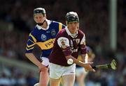 14 May 2000; Ollie Fahy of Galway in action against Philip Maher of Tipperary during the Church & General National Hurling League Final match between Tipperary and Galway at the Gaelic Grounds in Limerick. Photo by Brendan Moran/Sportsfile