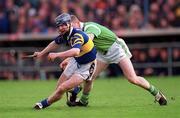 30 April 2000; Paddy O'Brien of Tipperary in action against Stephen McDonagh of Limerick during the Church & General National Hurling League Division 1 Semi-Final match between Tipperary and Limerick at Semple Stadium in Thurles, Tipperary. Photo by Ray McManus/Sportsfile
