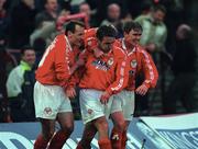 5 May 2000; Pat Fenlon of Shelbourne, centre, is congratulated by team-mates Stephen Geoghegan, left, and Richie Baker, after scoring his side's opening goal during the FAI Cup Final Replay match between Shelbourne and Bohemians at Dalymount Park in Dublin. Photo by Ray McManus/Sportsfile