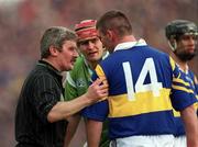 30 April 2000; Referee Pat Horan speaks to Paul Shelly of Tipperary and TJ Ryan of Limerick during the Church & General National Hurling League Division 1 Semi-Final match between Tipperary and Limerick at Semple Stadium in Thurles, Tipperary. Photo by Ray McManus/Sportsfile