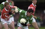 20 May 2000; Pat Windle of Limerick in action against Aidan Dorgan of Cork during the Bank of Ireland Munster Senior Football Championship Quarter-Final match between Limerick and Cork at Fitzgerald Park in Kilmallock, Limerick. Photo by Damien Eagers/Sportsfile
