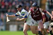 30 April 2000; Paul Flynn of Waterford in action against Liam Hodgins of Galway during the Church & General National Hurling League Division 1 Semi-Final match between Galway and Waterford at Semple Stadium in Thurles, Tipperary. Photo by Damien Eagers/Sportsfile