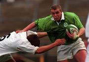 28 April 2000; Alfie Harte of Ireland is tackled by Deacon Brett of England during the 4 Nations U18 Championship match between Ireland and England at Lansdown Road in Dublin. Photo by Matt Browne/Sportsfile