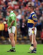 30 April 2000; TJ Ryan of Limerick and Paul Shelly of Tipperary stand for the national anthem prior to the Church & General National Hurling League Division 1 Semi-Final match between Tipperary and Limerick at Semple Stadium in Thurles, Tipperary. Photo by Damien Eagers/Sportsfile