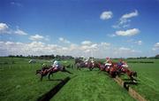 2 May 2000; Eventual third place Tearaway King, left, with John Thomas McNamara up, leads eventual winner Digacre, 2, with Aonghus McNamara up, and second place Buaites And Fadas, 19, with Philip Fenton up, over the double bank during the Ernst & Young Steeplechase at Punchestown Racecourse in Kildare. Photo by Matt Browne/Sportsfile