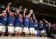 20 May 2000; St Mary's captain Trevor Brennan lifts the trophy as he celebrates with team-mates following their side's victory during the AIB All-Ireland League Final match between Lansdowne and St Mary's at Lansdowne Road in Dublin. Photo by Brendan Moran/Sportsfile