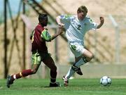 1 May 2000; Stephen Brennan of Republic of Ireland in action against Valdir of Portugal during the UEFA U16 European Championship Finals match between Portugal and Republic of Ireland at Be'er Sheva Municipal Stadium in Be'er Sheva, Israel. Photo by David Maher/Sportsfile