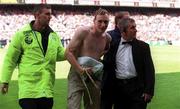 21 May 2000; A pitch invader is removed from the field by security during the Steve Staunton and Tony Cascarino Testimonial match between Republic of Ireland XI and Liverpool at Lansdowne Road in Dublin. Photo by Brendan Moran/Sportsfile