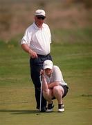 9 May 2000; Suzie Hayes, Hermitage, lines up a putt on the 9th green with the help of her father and caddy Tony Hayes during the Lancome Irish Ladies Close Championship at County Louth Golf Club in Baltry, Louth. Photo by Damien Eagers/Sportsfile