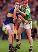 30 April 2000; TJ Ryan of Limerick in action against Andy Moloney of Tipperary during the Church & General National Hurling League Division 1 Semi-Final match between Tipperary and Limerick at Semple Stadium in Thurles, Tipperary. Photo by Ray McManus/Sportsfile