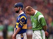 30 April 2000; Thomas Dunne of Tipperary and Stephen McDonagh of Limerick stand for the national anthem prior to the Church & General National Hurling League Division 1 Semi-Final match between Tipperary and Limerick at Semple Stadium in Thurles, Tipperary. Photo by Damien Eagers/Sportsfile